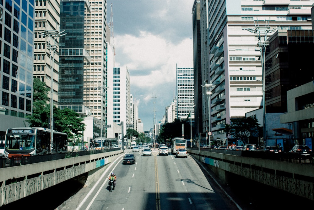 a city street filled with lots of tall buildings