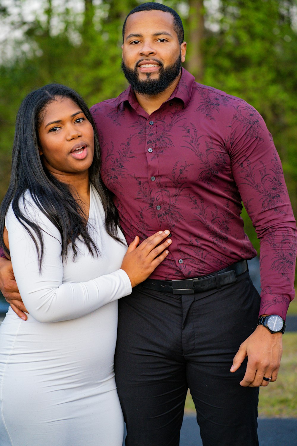 a man and a woman pose for a picture