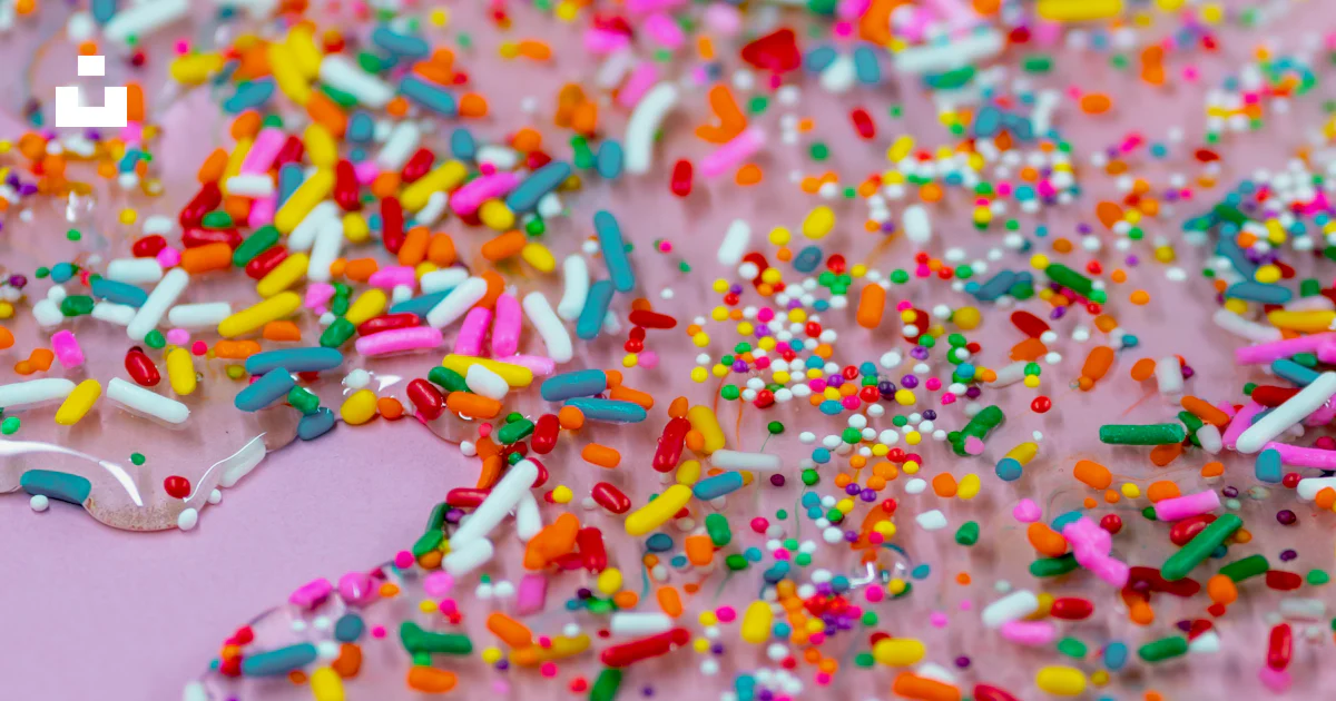 A bunch of sprinkles that are on a table photo – Free Sprinkles Image ...