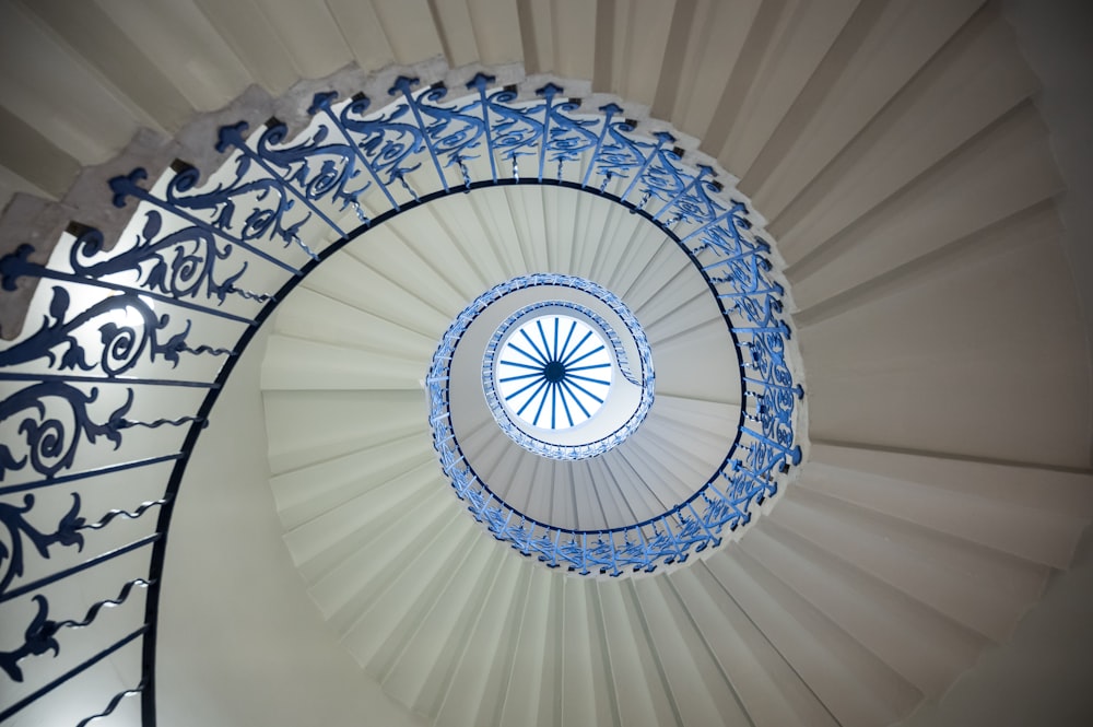 a spiral staircase with a blue and white design