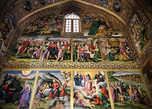 A vibrant mural depicting the story of the passion and resurrection, painted by artists of various cultures.