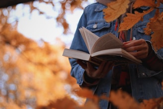 a person holding a book in their hands