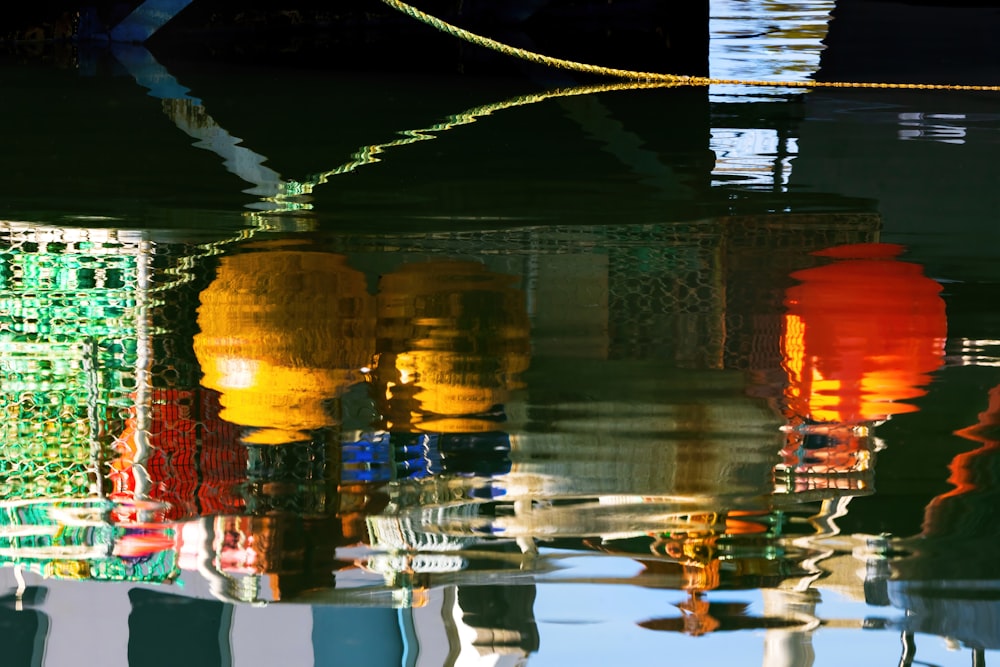 a reflection of fire hydrants in the water