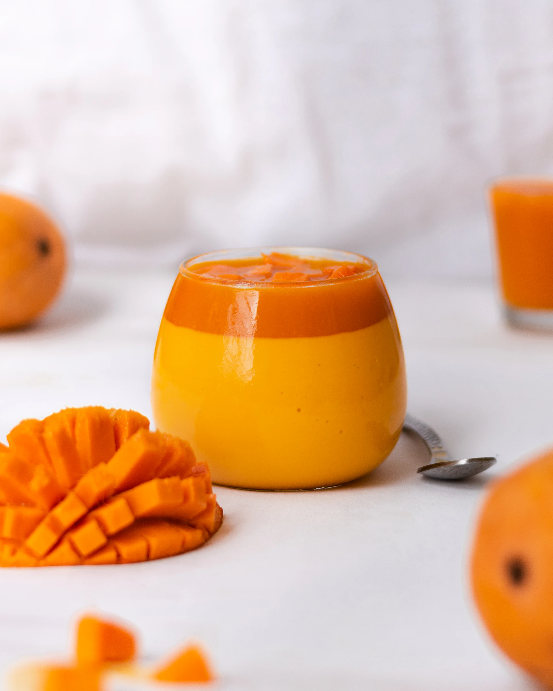 a close up of oranges on a white table