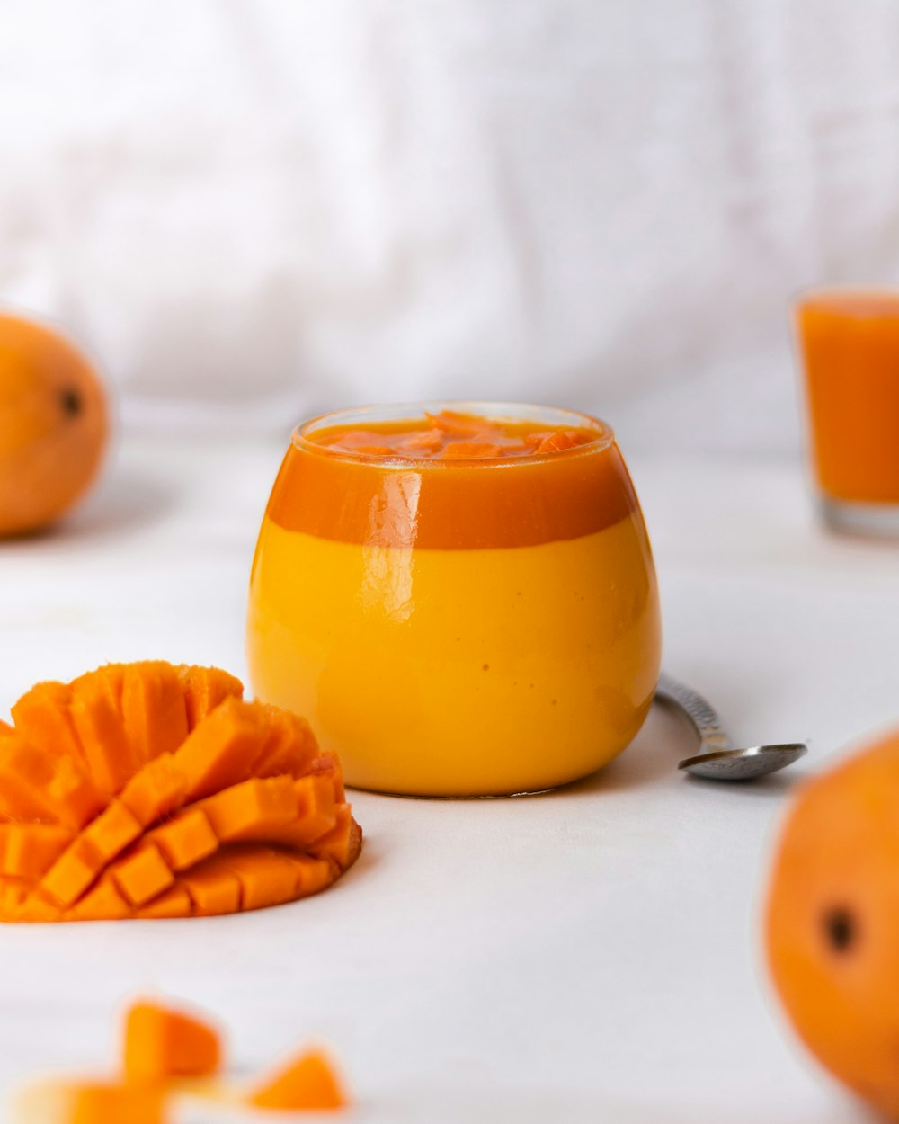 a close up of oranges on a white table