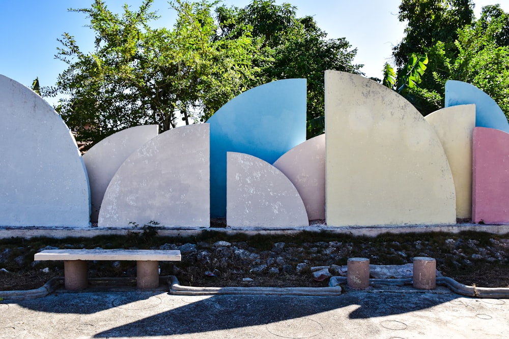 a bench sitting next to a row of surfboards