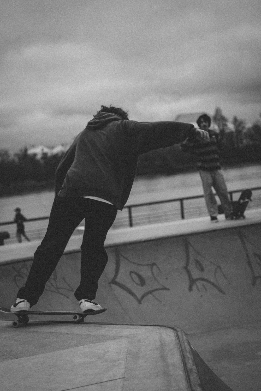 a man riding a skateboard up the side of a ramp