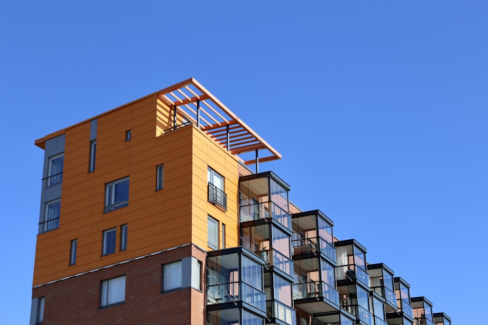 a tall building with balconies and balconies on top