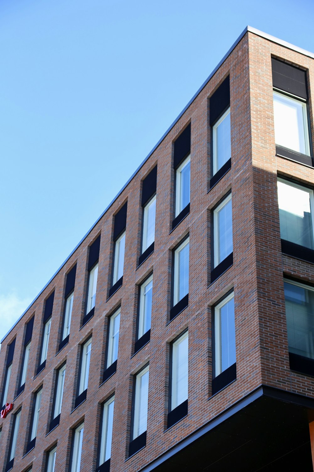 a tall brick building with lots of windows