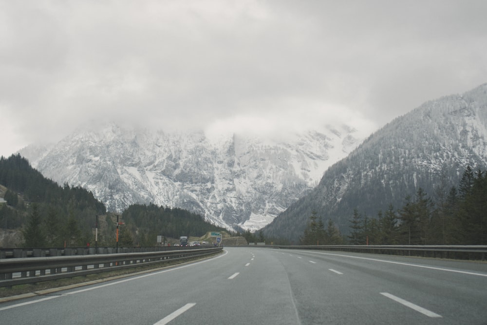 a highway with mountains in the background