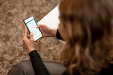 A user filling out a detailed online form on a tablet