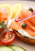 A bagel sandwich filled with smoked salmon, capers, and fresh dill.