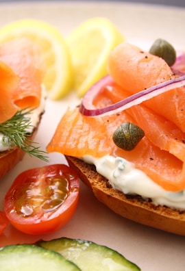 A bagel sandwich filled with smoked salmon, capers, and fresh dill.