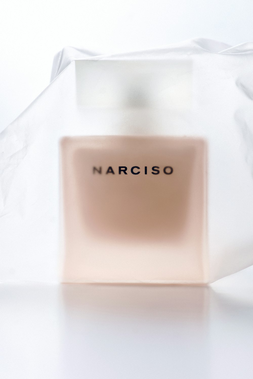 a bottle of narciso on a white surface