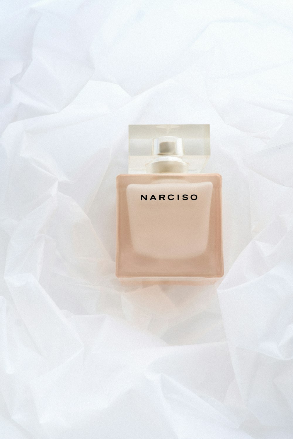 a bottle of narcicoo on a white sheet