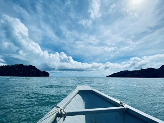 A boat traveling across a large body of water — Langkawi, Malaysia