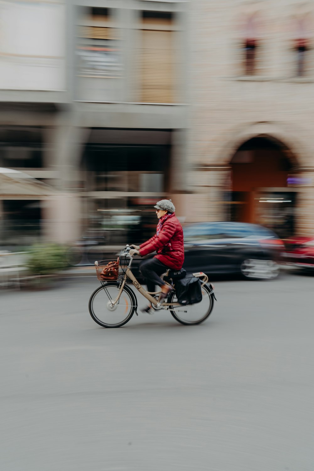 a person riding a bike down a street