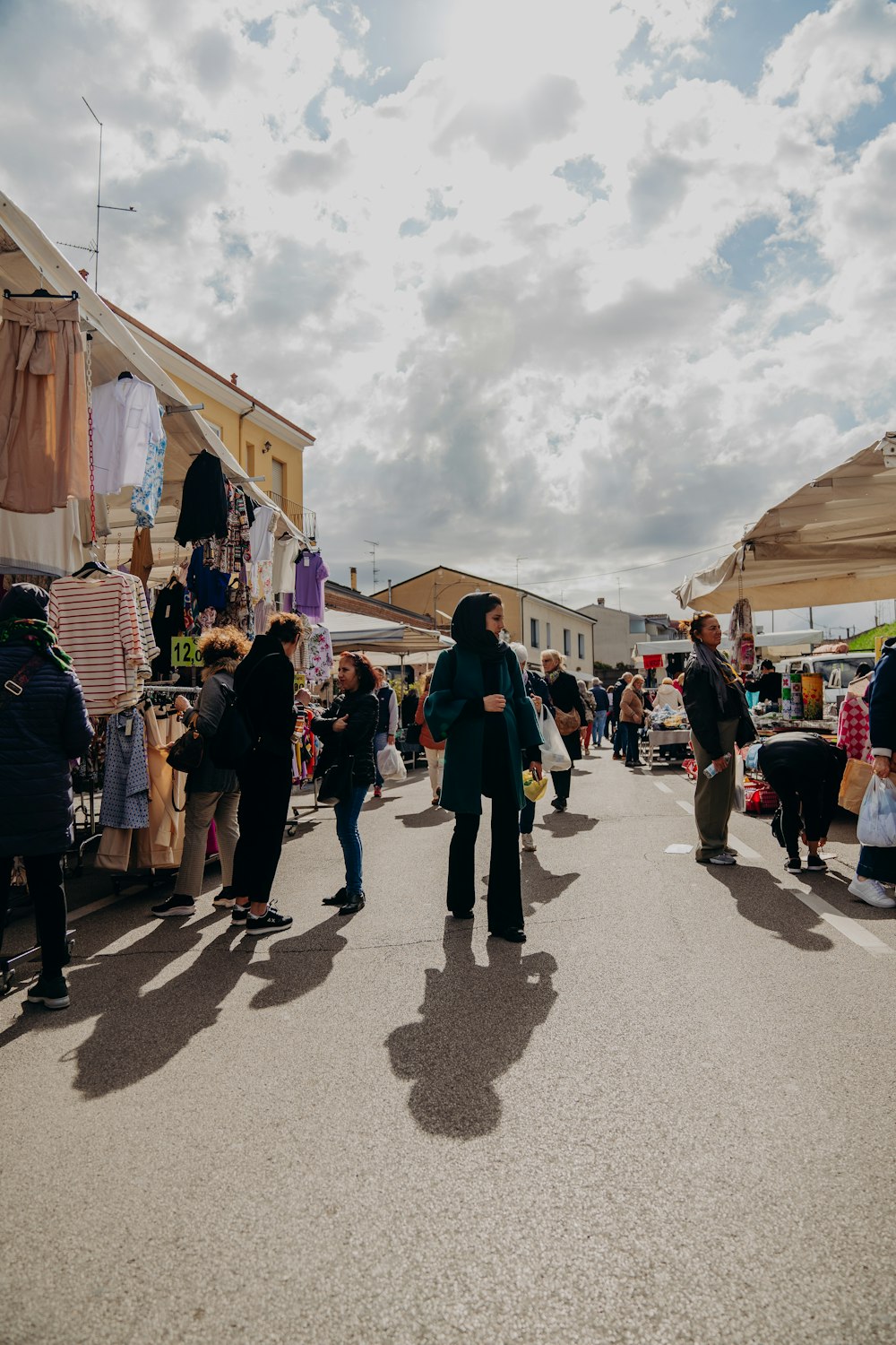 a group of people standing around a market