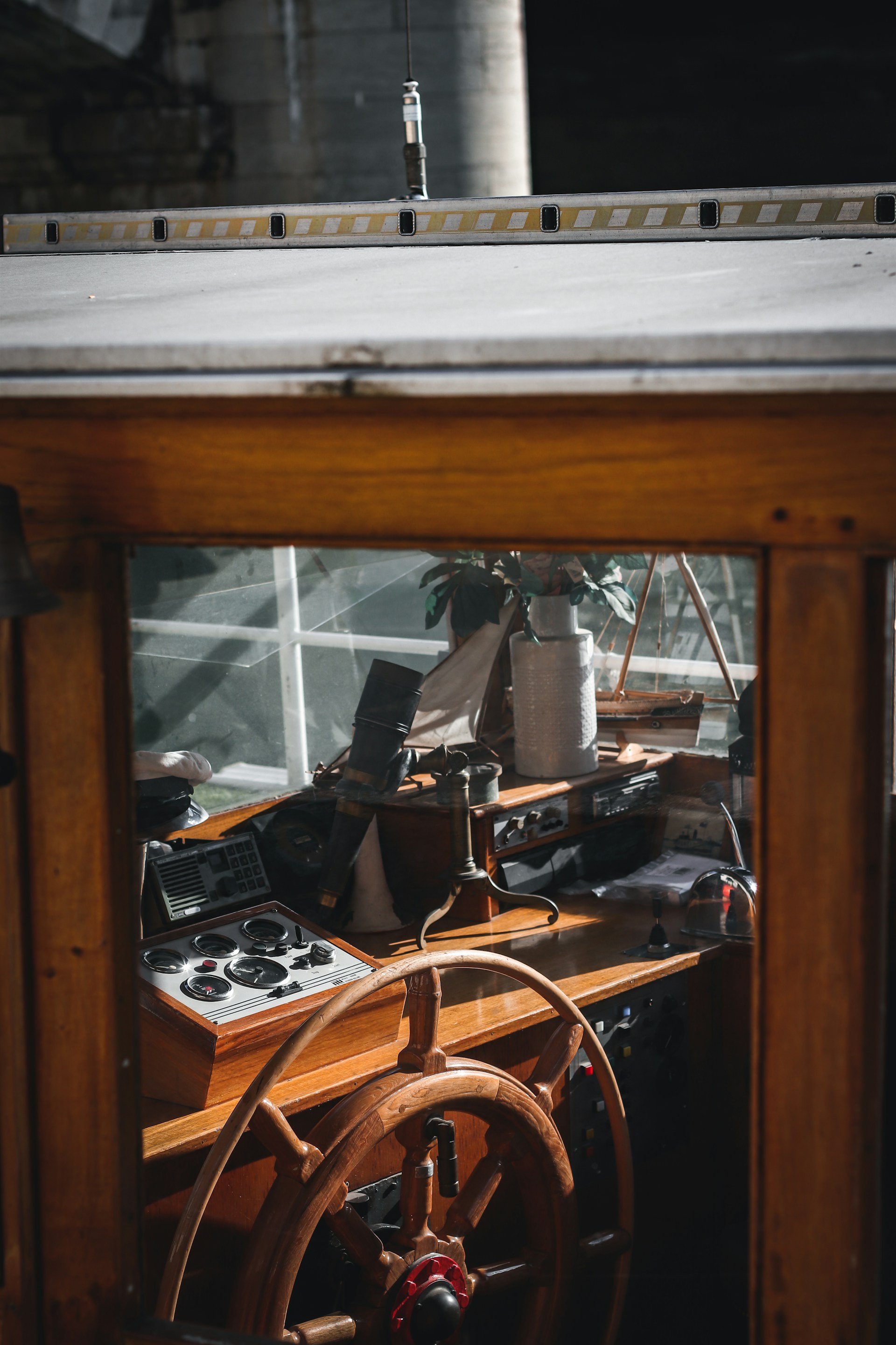 a steering wheel on a wooden table in a room