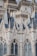 Detailed architectural design featuring intricate spires, ornate patterns, and neo-gothic elements with blue-tiled roofs and pointed arches.
