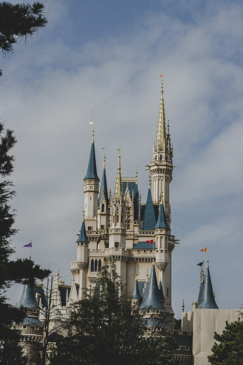 a very tall castle with a clock on it's side