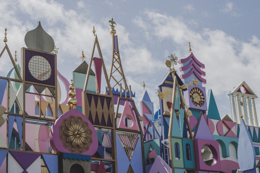 a colorful building with a clock on the top of it