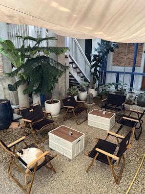 An outdoor area with PVC mats arranged for relaxation.