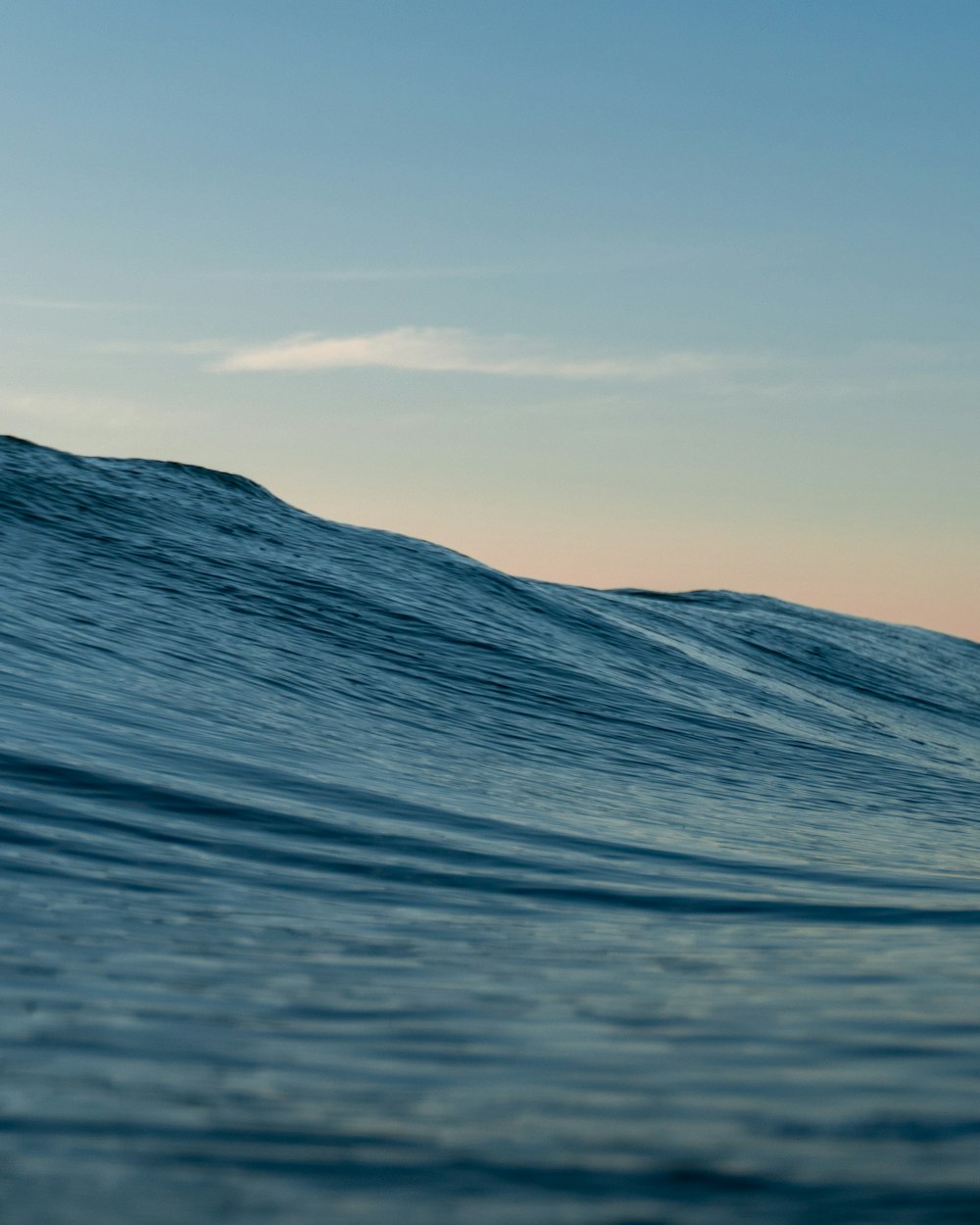 a person riding a wave on top of a surfboard