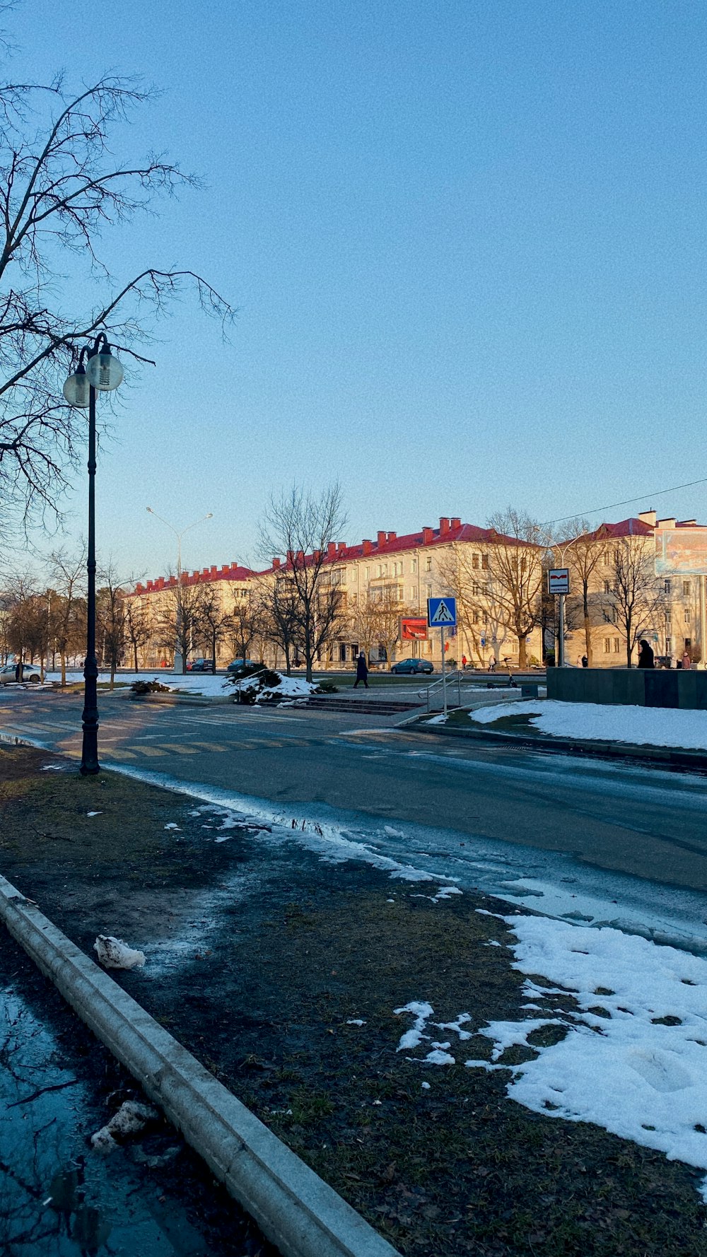 a city street with snow on the ground