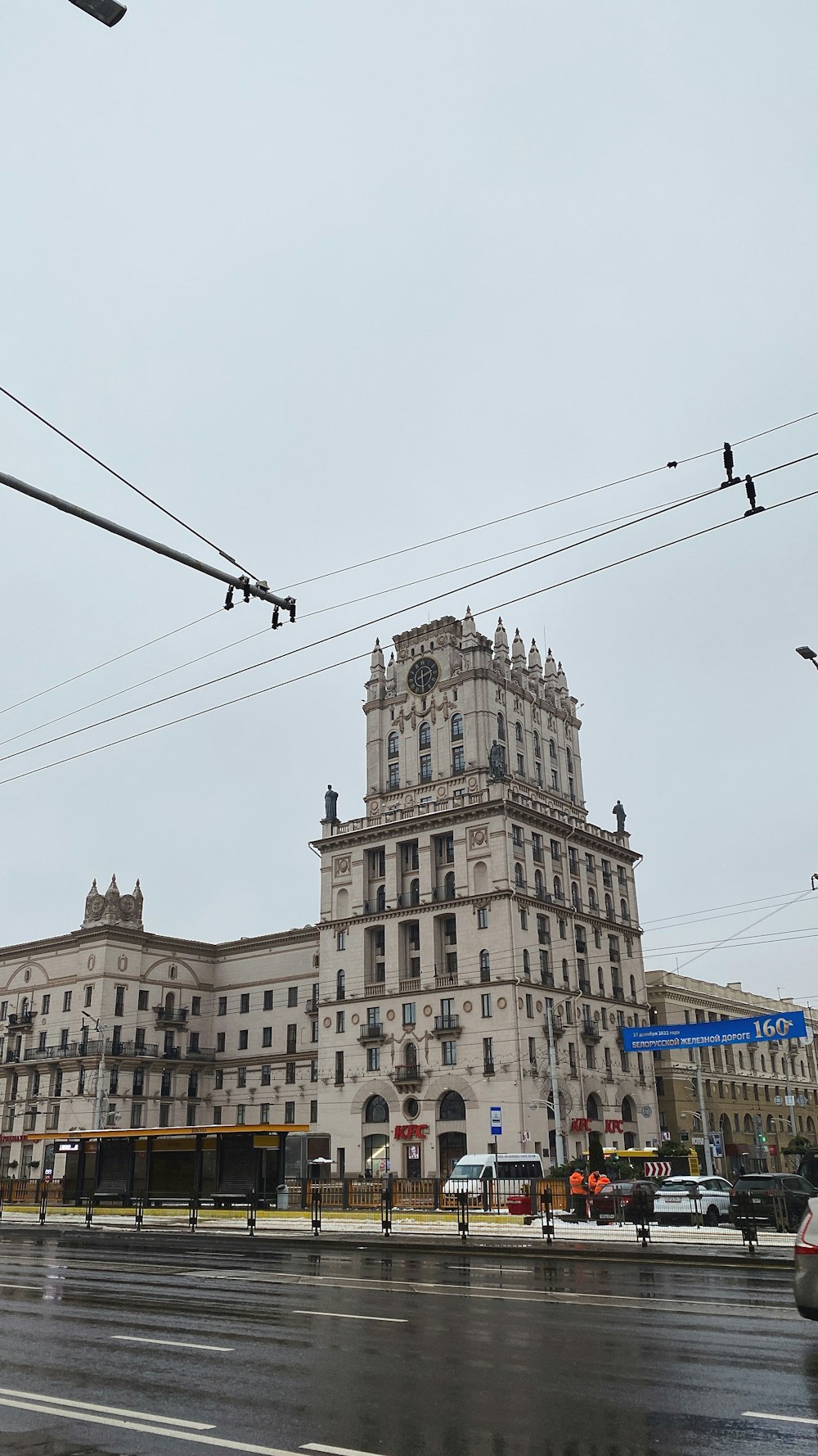 a very tall building sitting on the side of a road