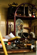 a fan sitting on top of a wooden shelf