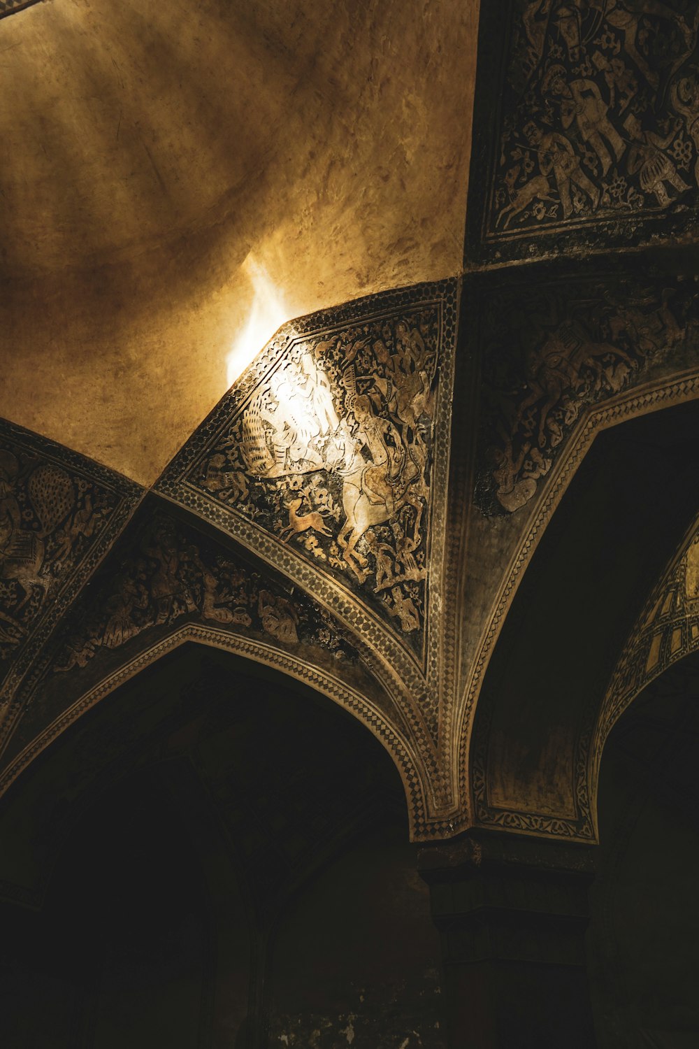 the ceiling of a building with intricate designs