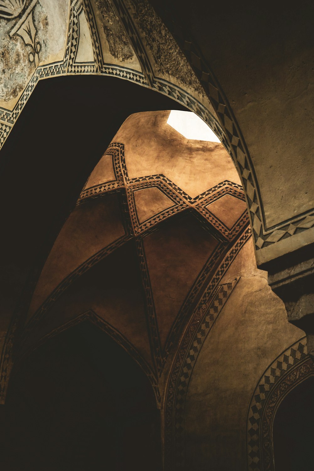 an arch in a building with a clock on it