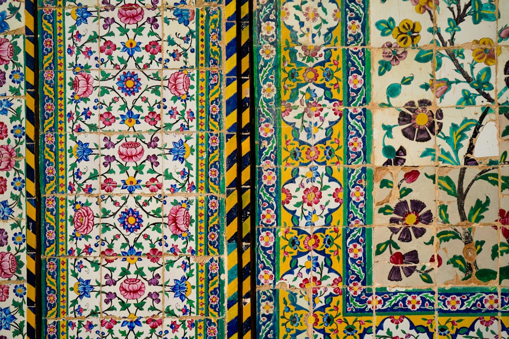 a close up of a decorative tile wall