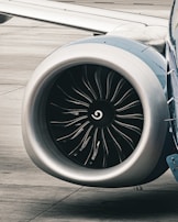 a close up of a jet engine on a runway