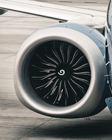 a close up of a jet engine on a runway