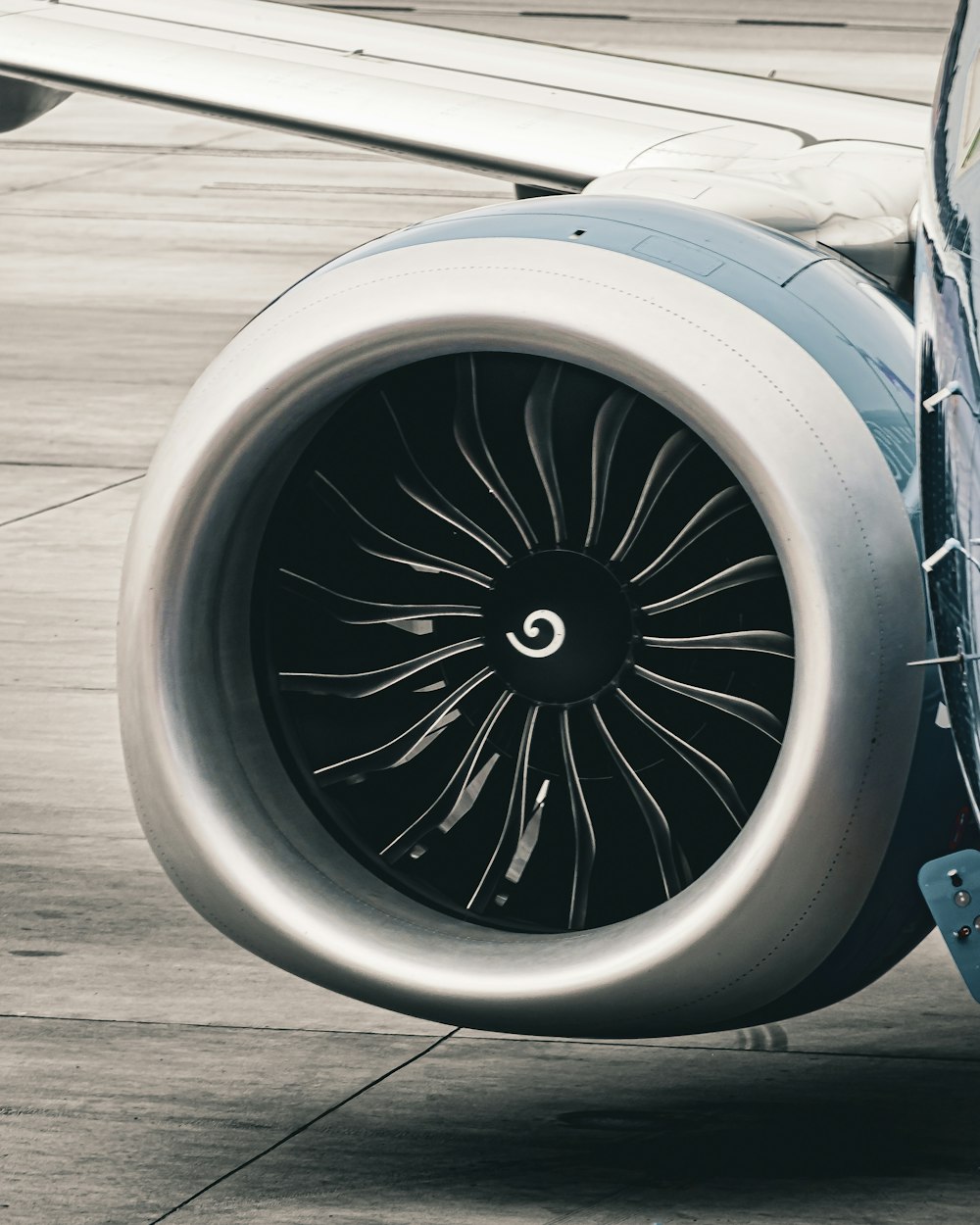 a close up of a jet engine on a runway