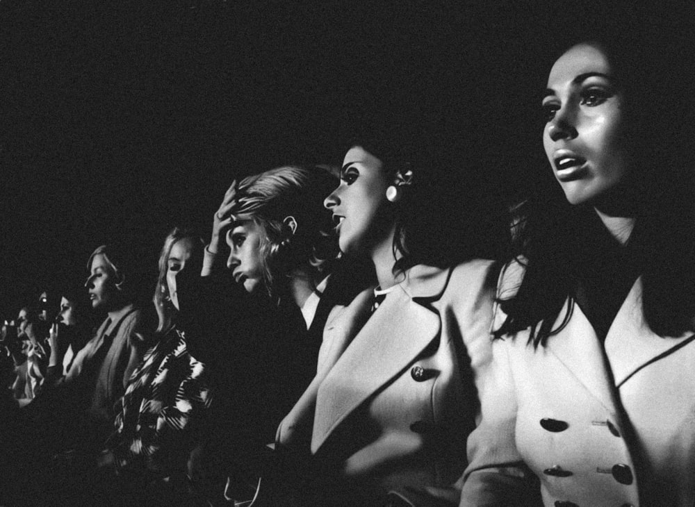 a group of women sitting next to each other