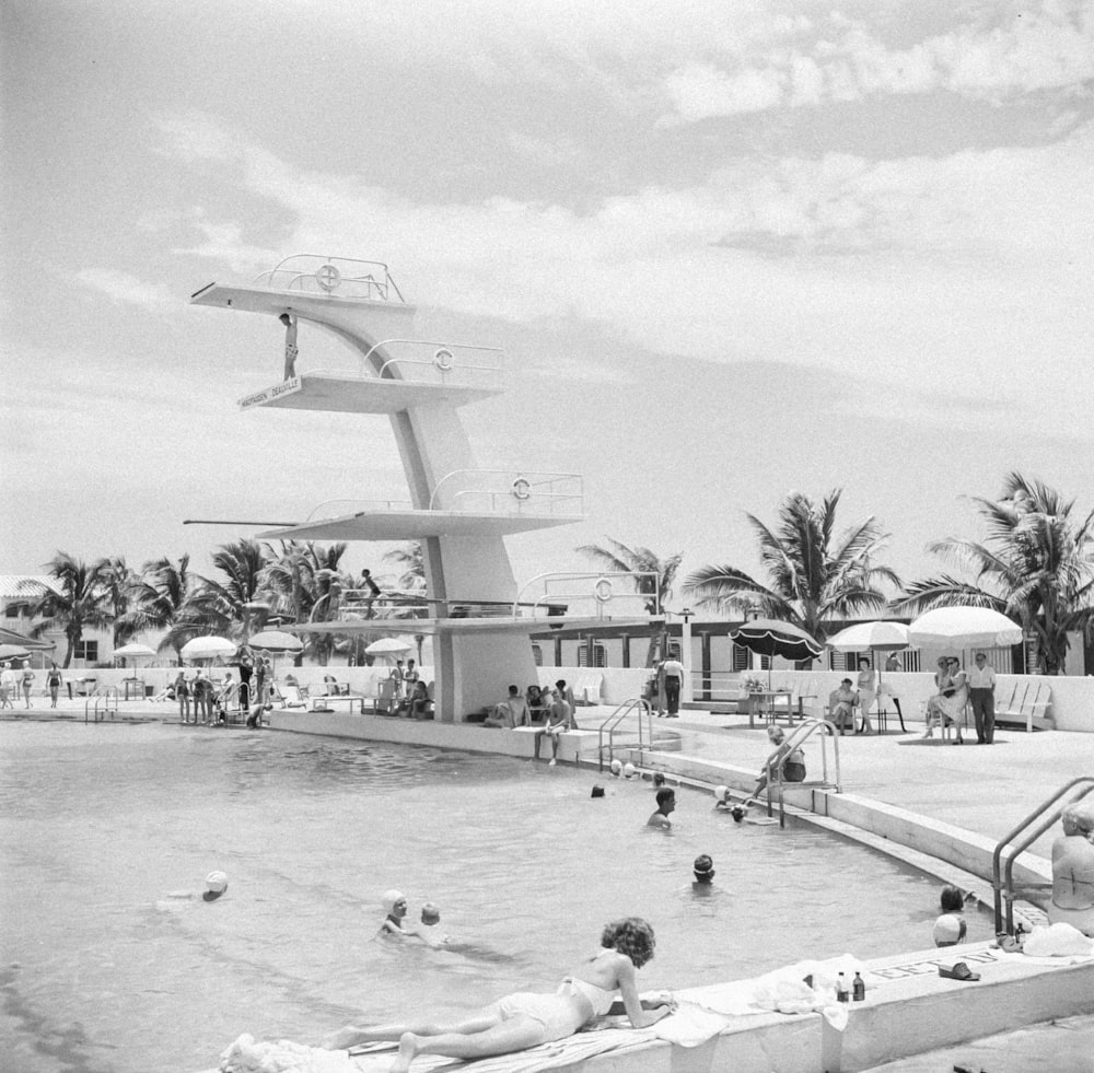 a large swimming pool with people in it