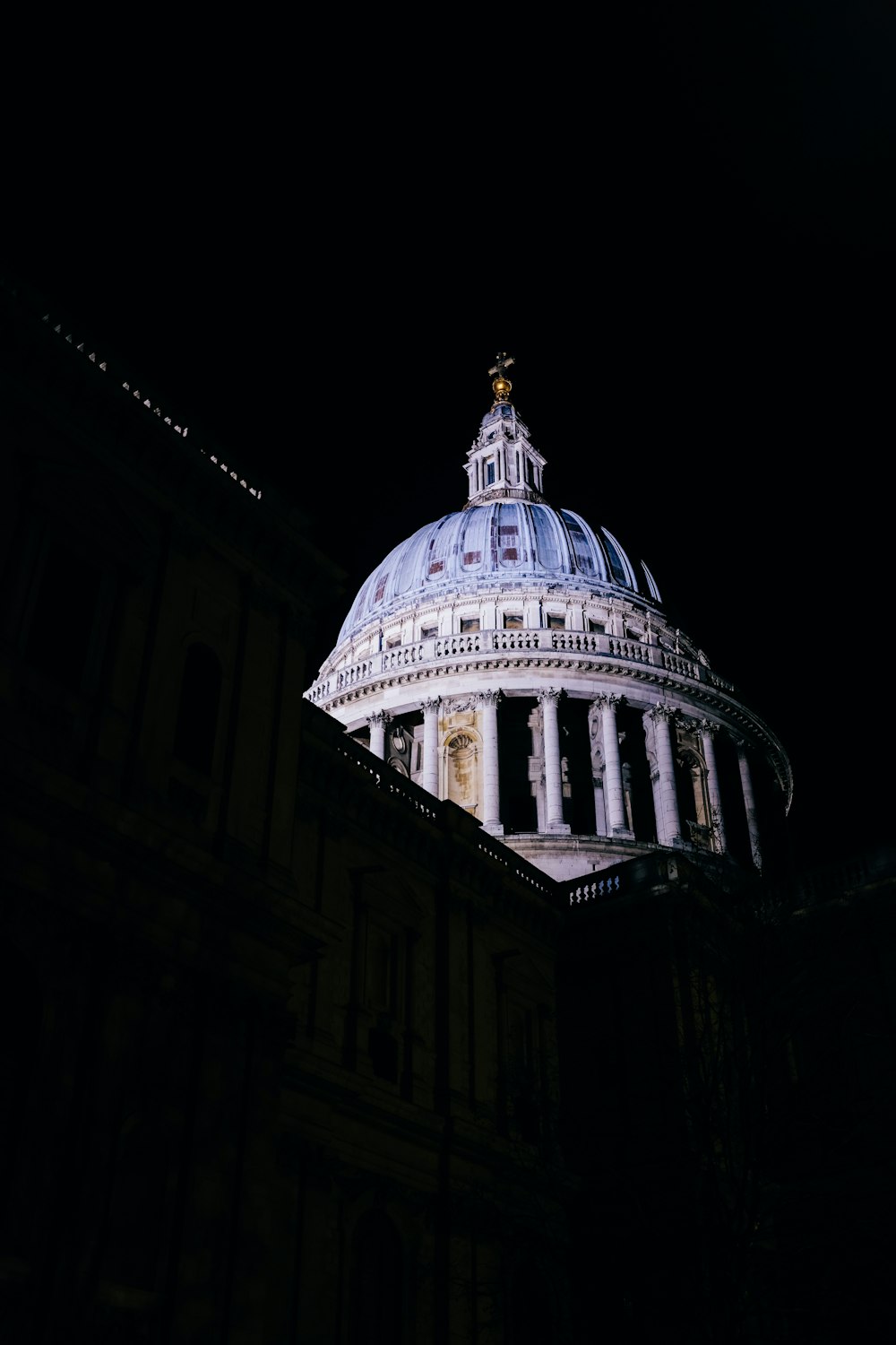 the dome of a building lit up at night