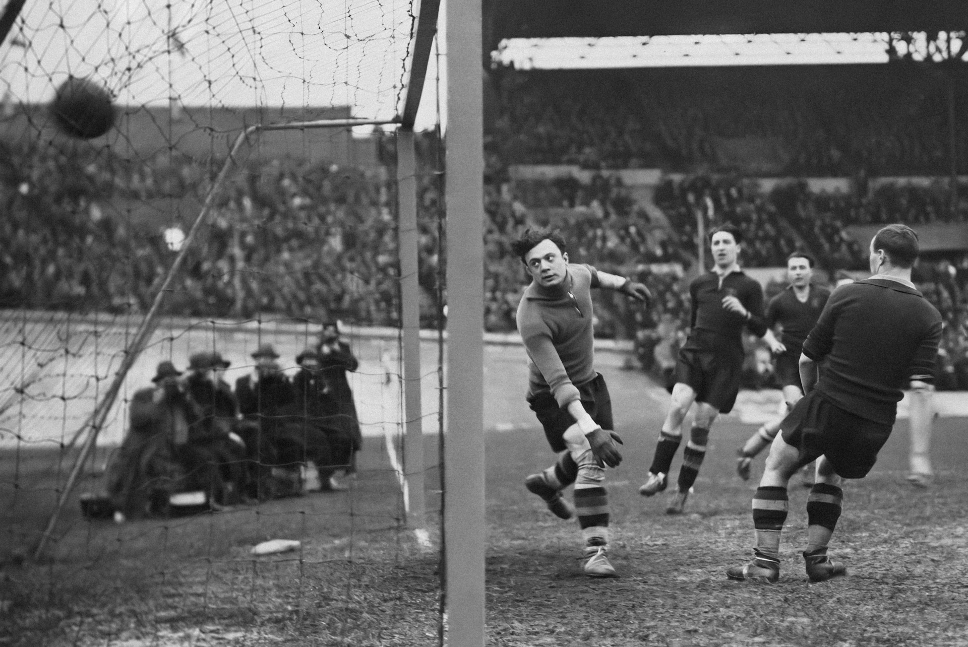 a group of men playing a game of soccer