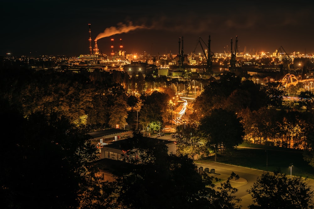 a view of a city at night from a hill