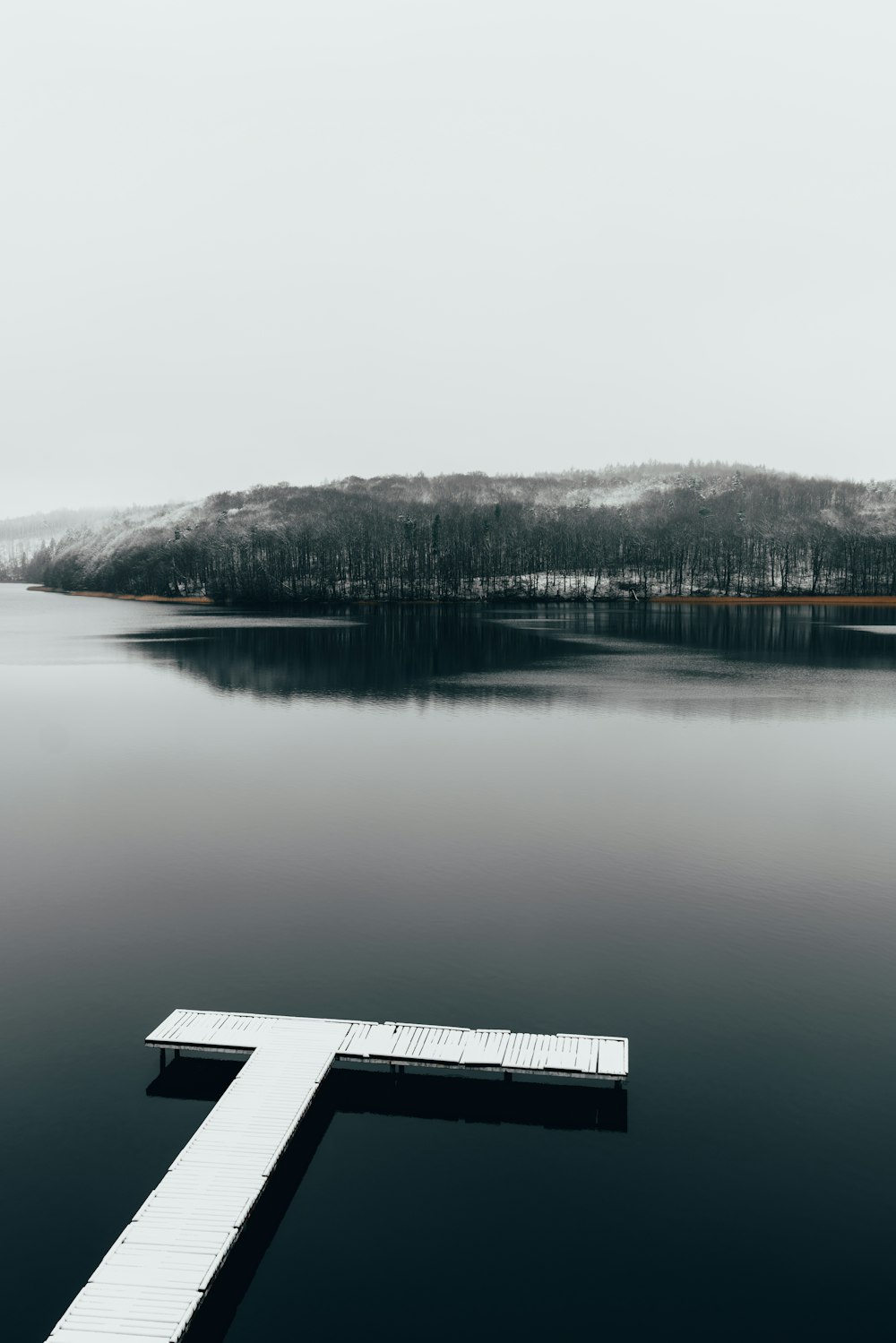 a dock sitting in the middle of a lake