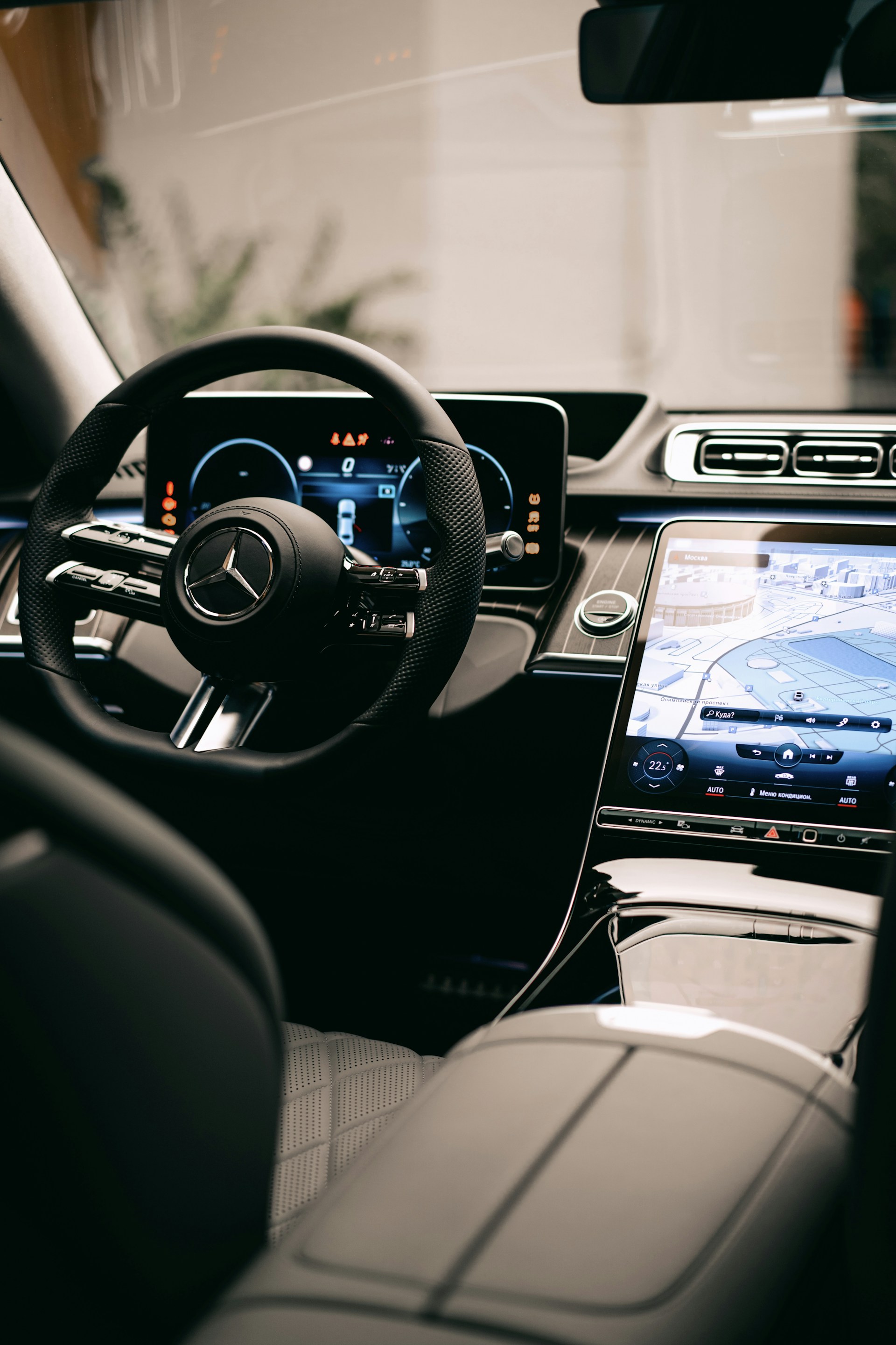 a car dashboard with a steering wheel and a dash board