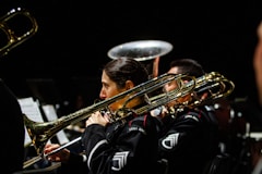 a group of people playing musical instruments in a band