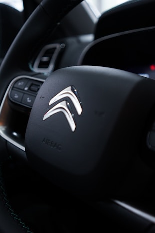 Interior shot of a Citroën car highlighting its modern dashboard and comfortable seats.