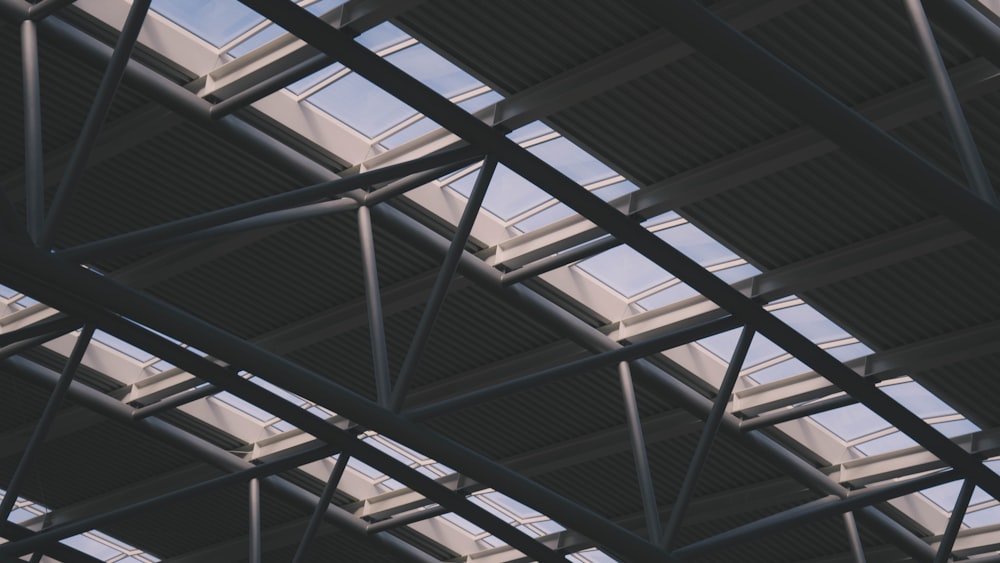 a close up of a metal structure with sky in the background