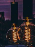 Close-up of vintage film lights glowing warmly against a dark backdrop.