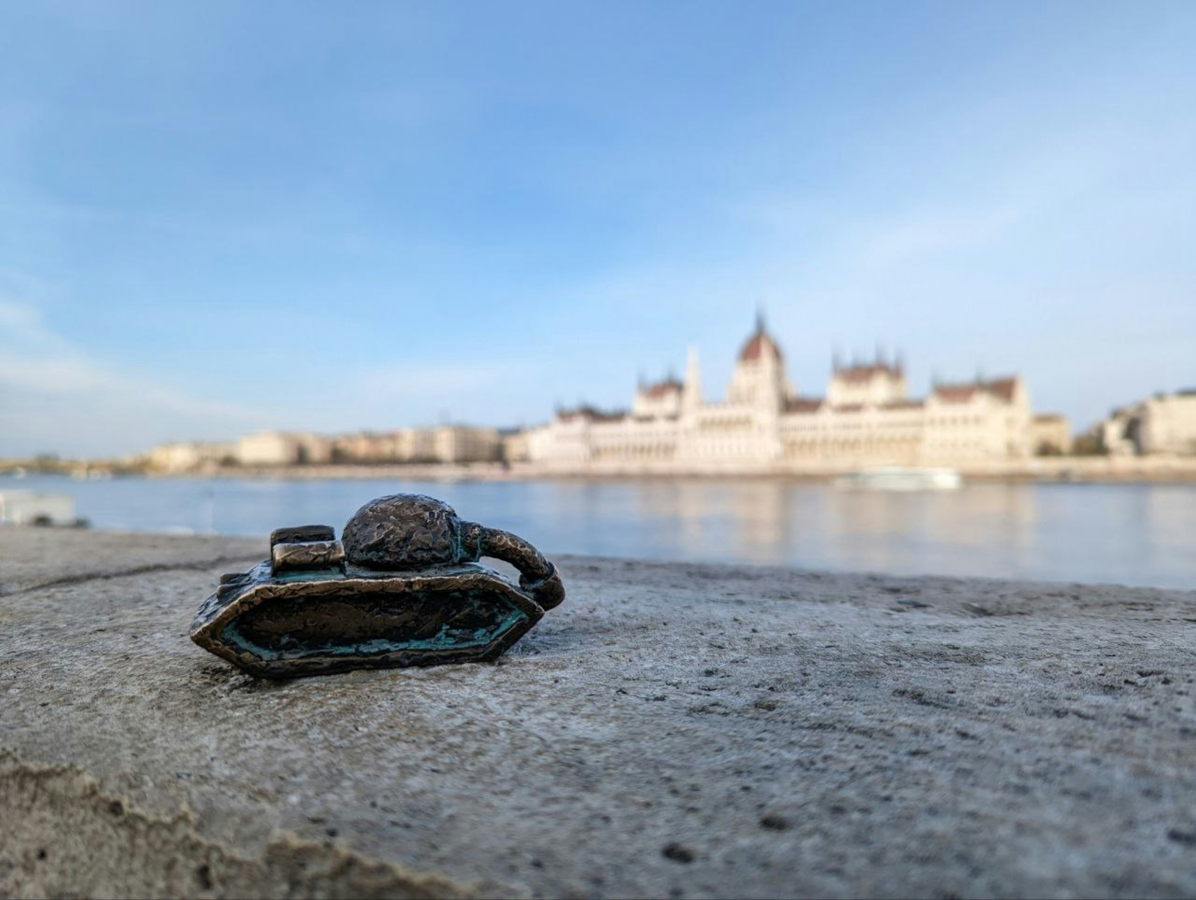 a close up of a crab on a rock near a body of water