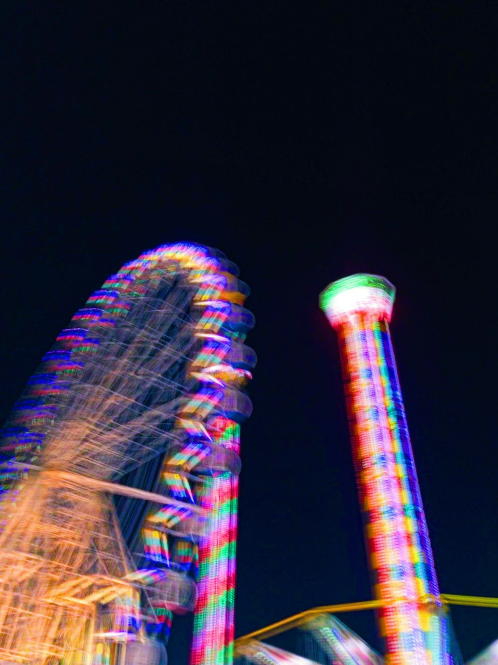 a ferris wheel and a ferris wheel at night